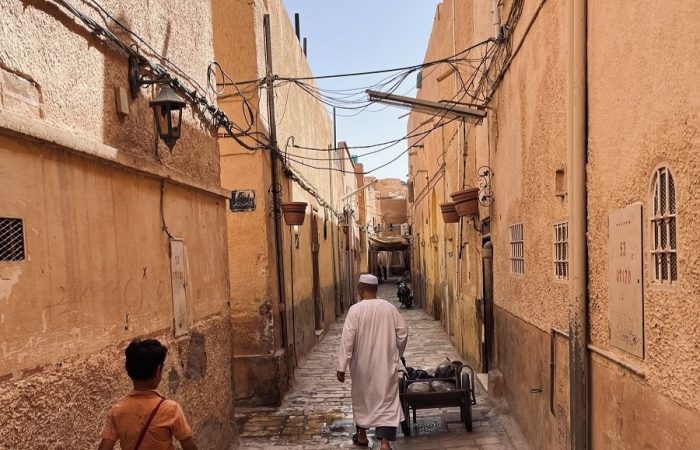 Man walks in ancient streets